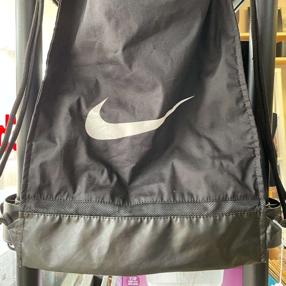 Blacked out NIKE JUST DO IT drawstring backpack
